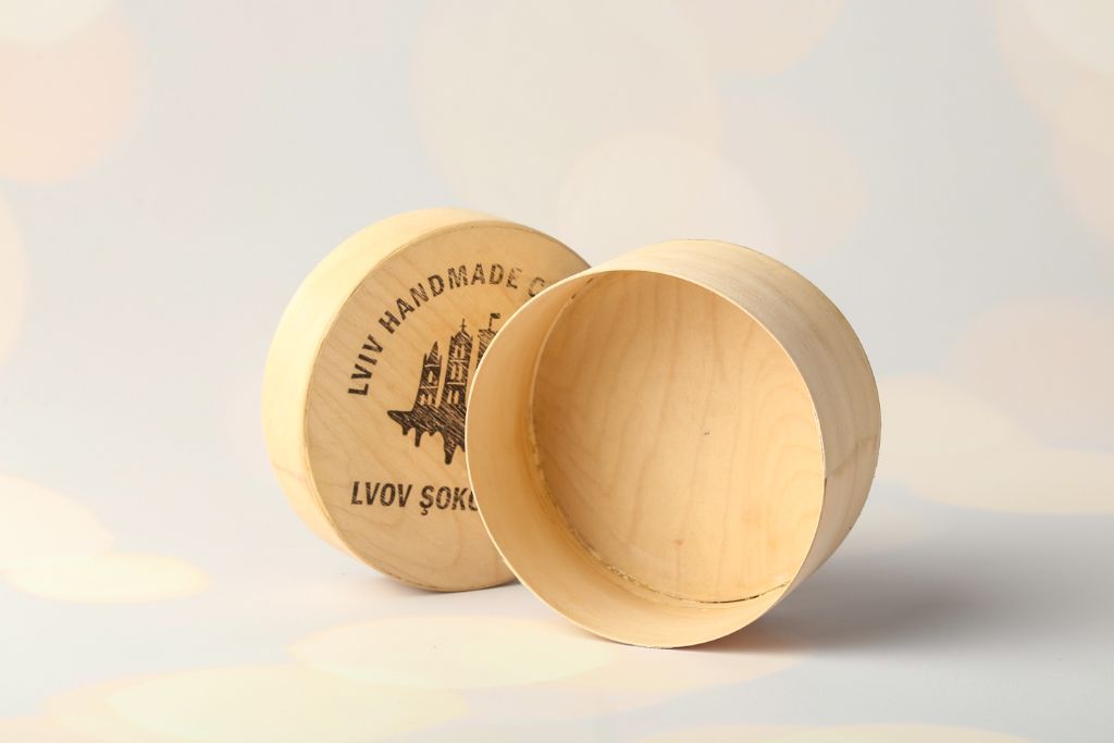 Round wooden box Lviv Handmade Chocolate — side view with lid