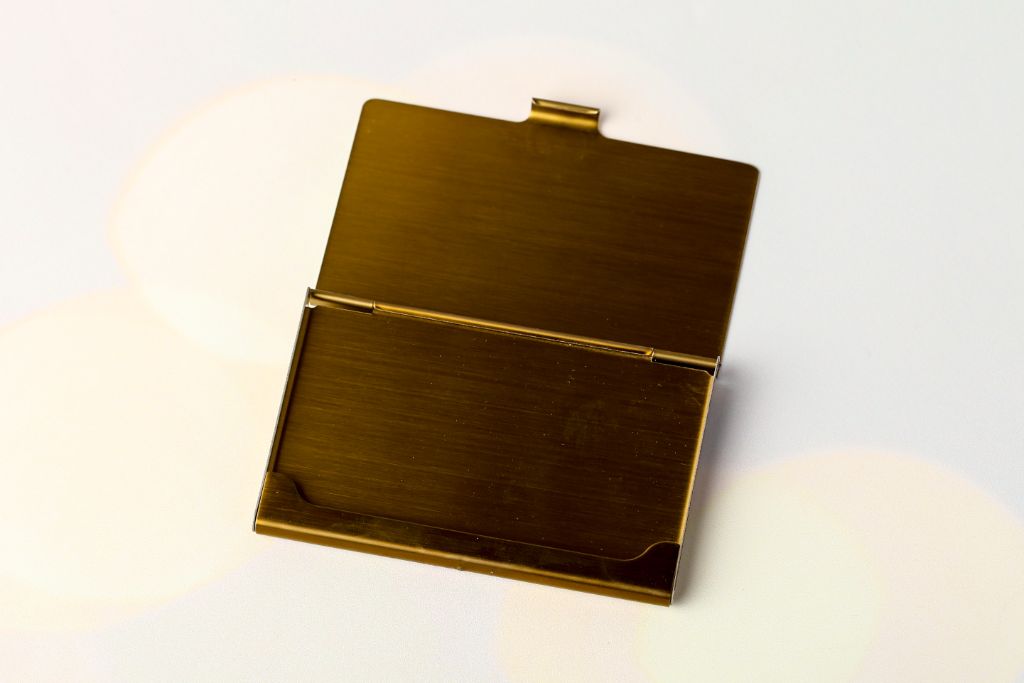 Metal business card holder — gold antique finish, open, inner compartment for business cards