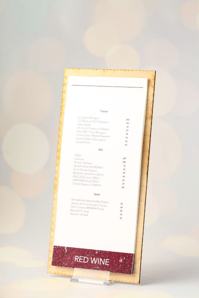 Wine Bar menu — light birch wood, laser-engraved logo, acrylic stand, side view