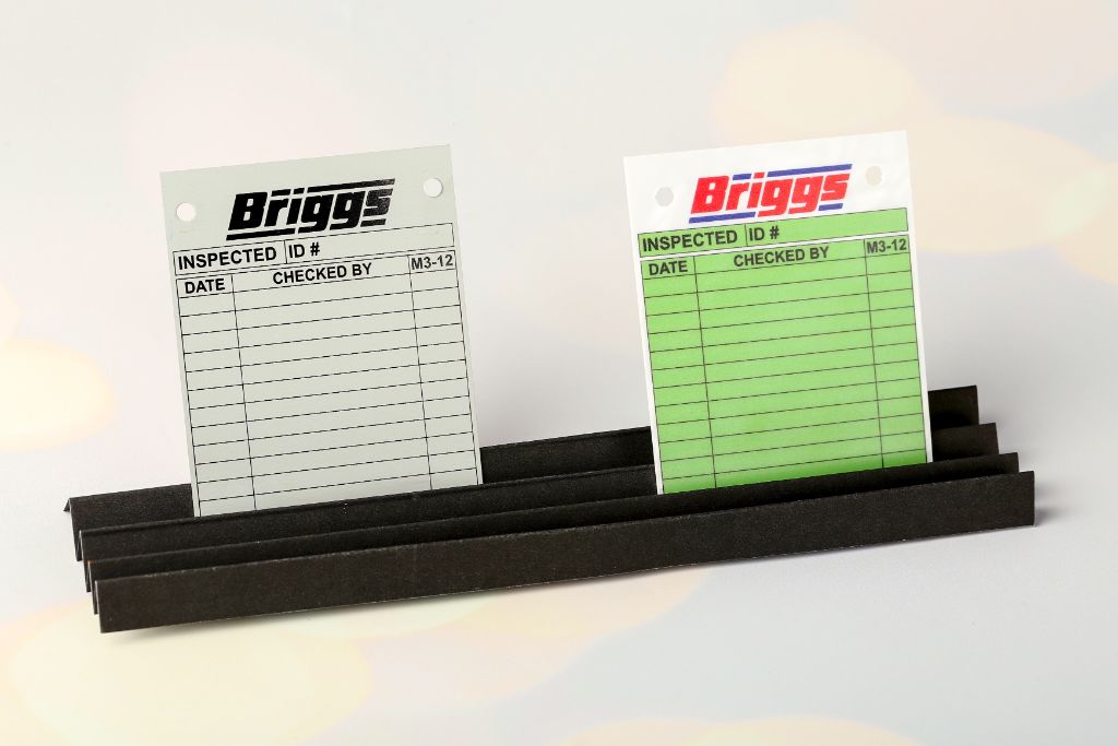 Briggs inspection control tags — pair: light grey and green, double-sided print, perforation