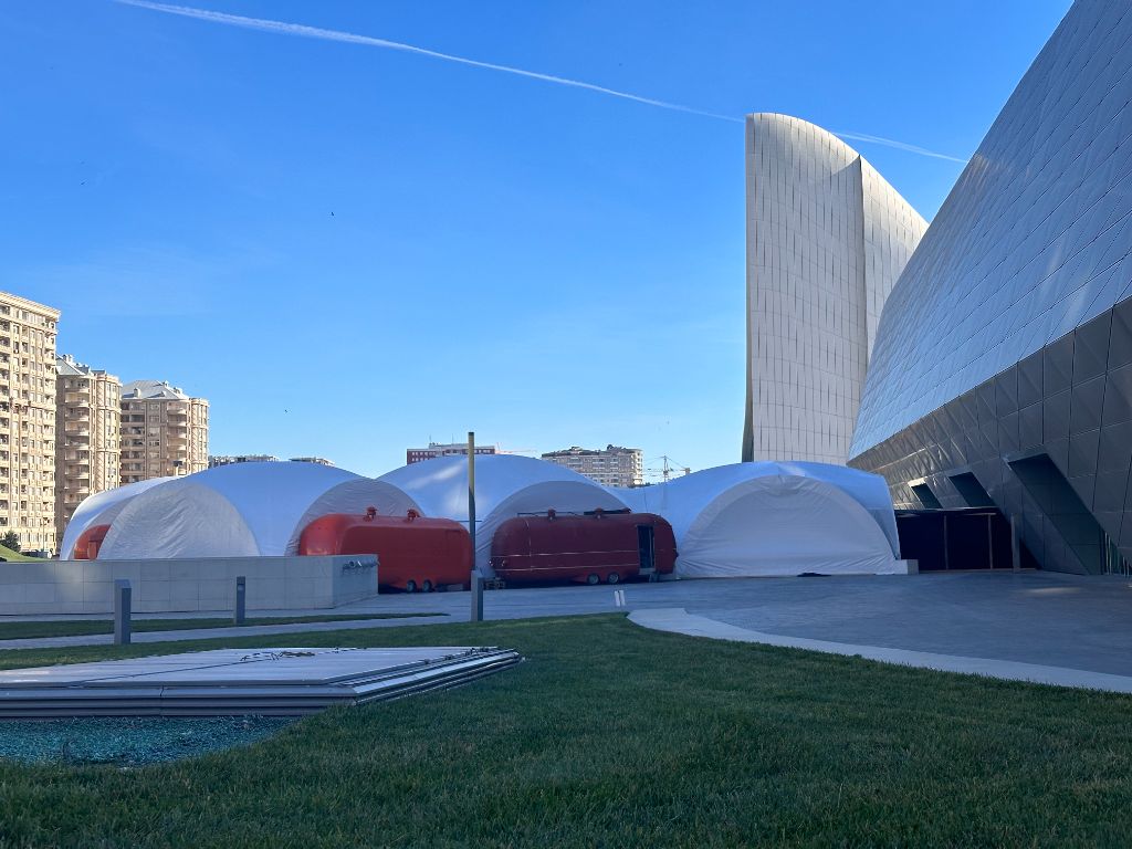 INMerge 2024 — outdoor dome networking tent setup at Baku Convention Center exterior
