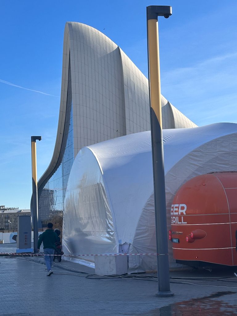 INMerge 2024 outdoor dome tent with Heydar Aliyev Center in background
