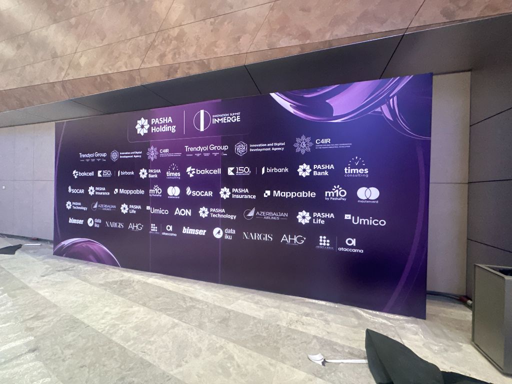 INMerge Innovation Summit 2024 — sponsors backdrop wall with PASHA Holding and 25+ partner logos