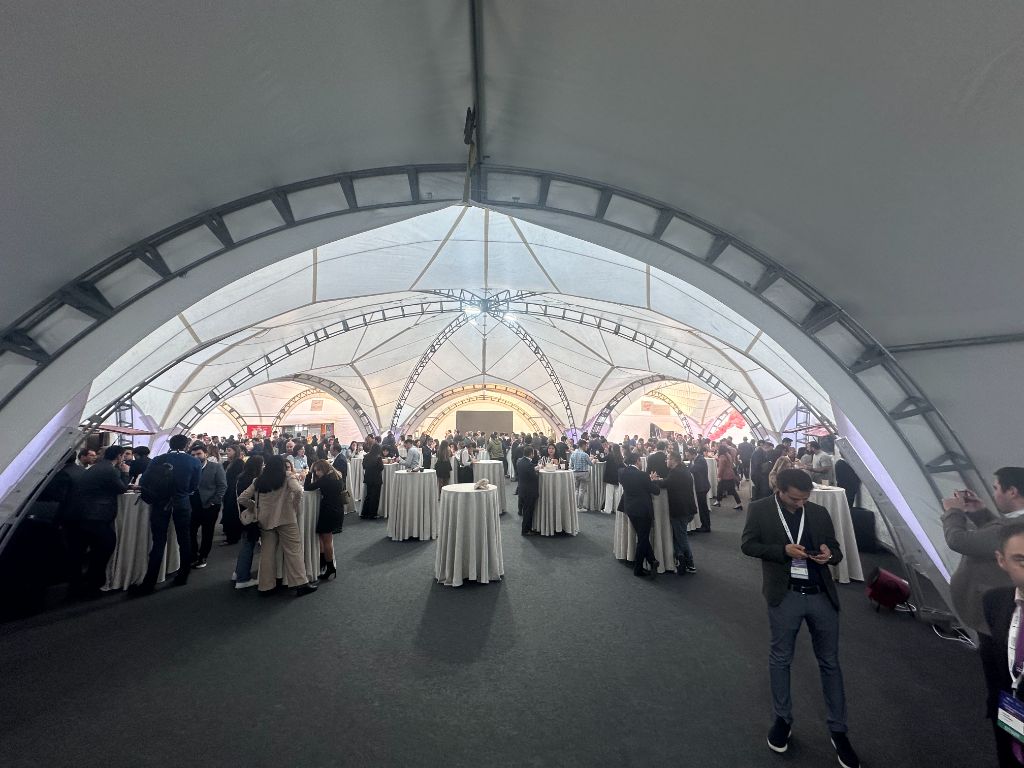 INMerge 2024 dome networking area — cocktail tables, 300+ attendees networking