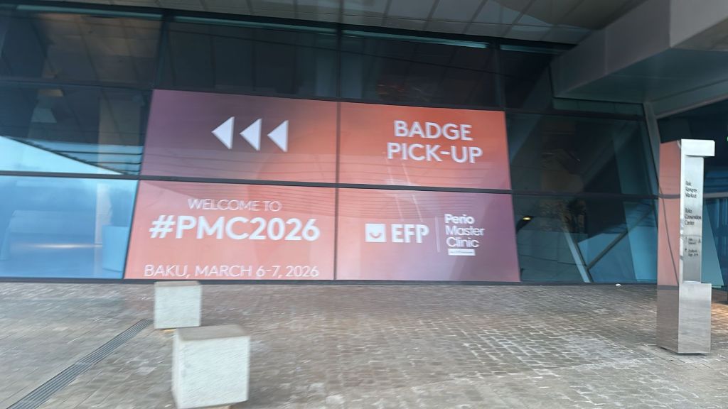 Badge pick-up LED display — PMC2026 entrance signage