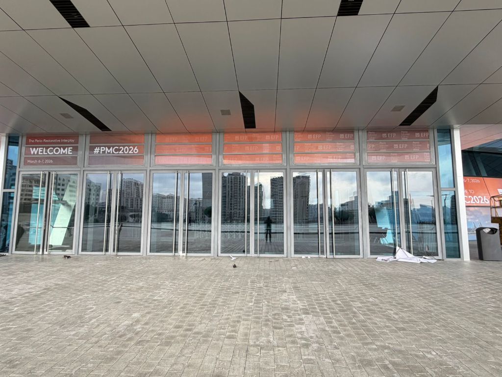 PMC2026 entrance wide view — full window branding with EFP logos