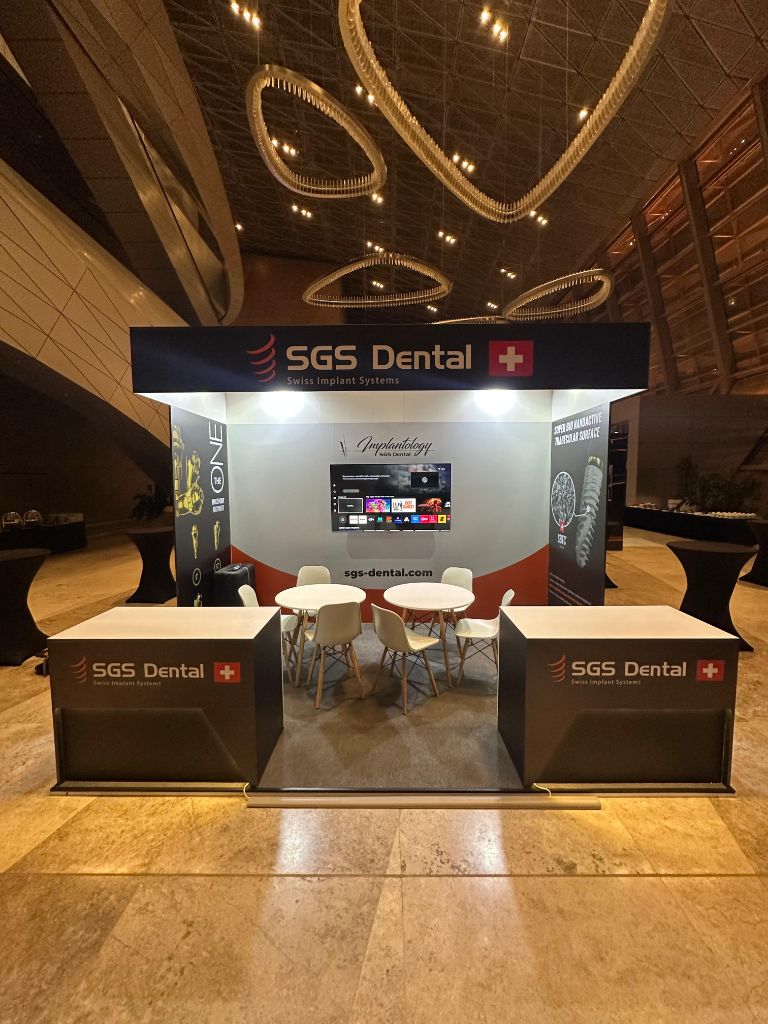 SGS Dental stand — full evening view with ring chandelier
