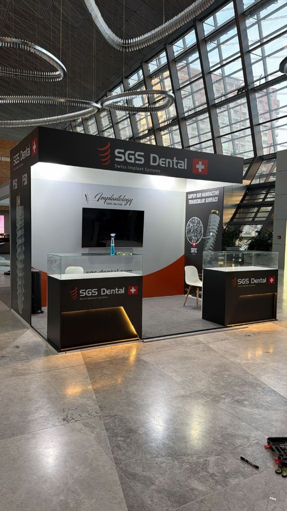 SGS Dental stand — morning light construction complete