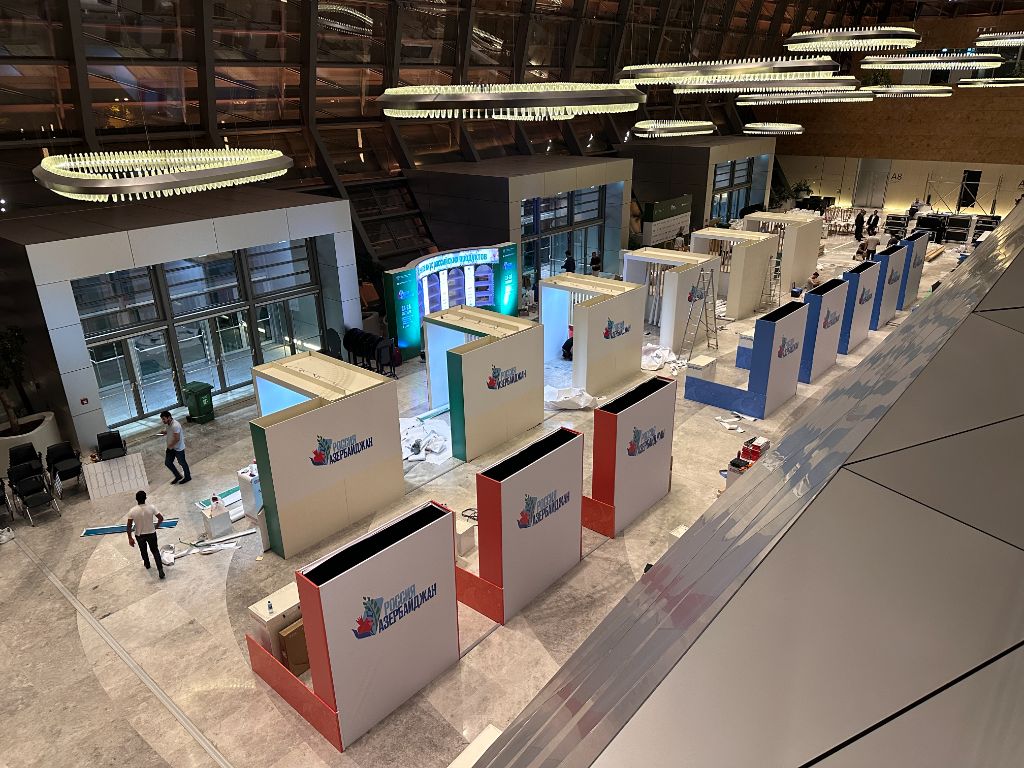 Exhibition hall during construction — overhead view of all pavilions being built