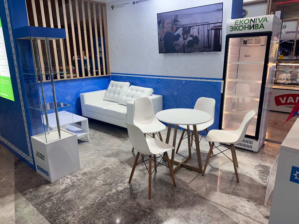 EkoNiva stand interior — meeting furniture, display screen