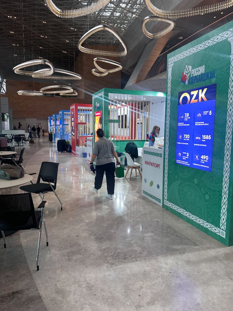 Exhibition hall view — multiple branded pavilions