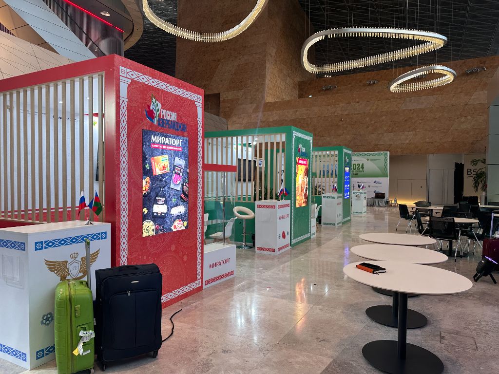 Finished exhibition hall — ready for opening day, multiple stands