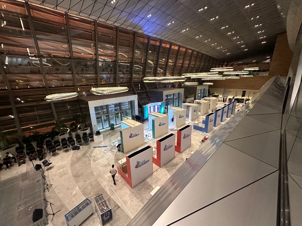Night shot — finished exhibition hall with all stands completed